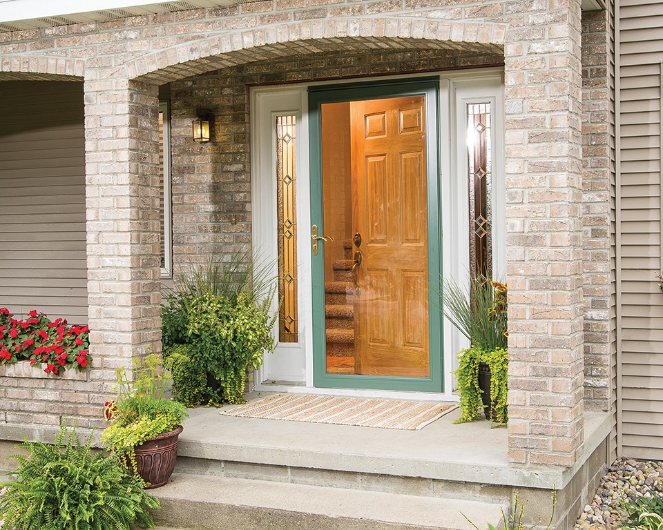 Attractive storm door for the home reduces front door maintenance.