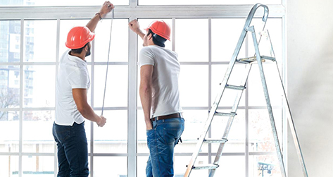 Repair Men Looking At Window