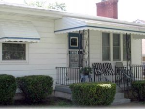 Awnings - Unified Home Remodeling Awning Windows With White Frames On A White House