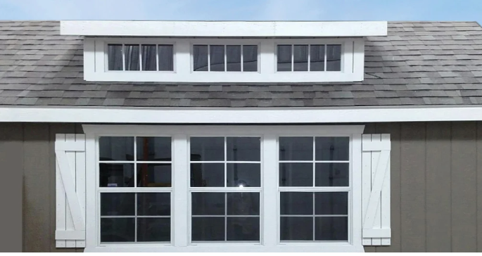 Your Home's Dormer Window: Choosing the Right One - Unified Home Remodeling shed roof dormer on gray home