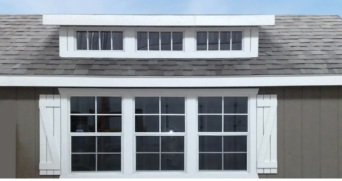 shed roof dormer on gray home