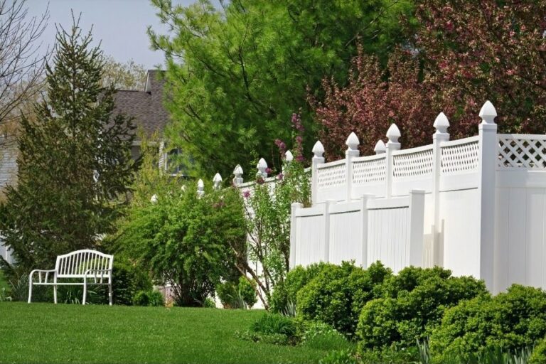 A serene and stylish Long Island backyard enhanced with a durable and aesthetic vinyl fence by Unified Home Remodeling.