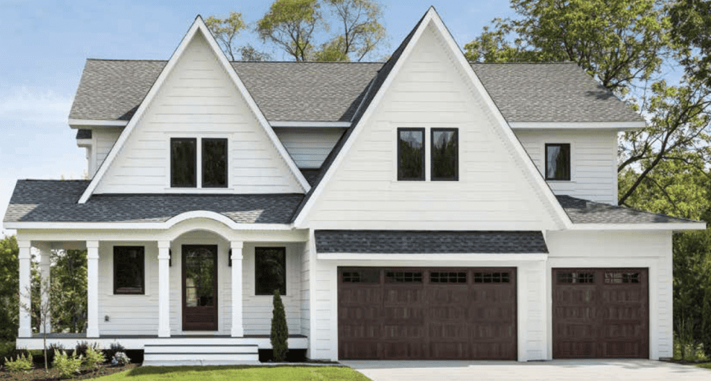 Dark-framed Andersen 100 Series Windows   installed in a white Long Island home by Unified, a certified Andersen Windows installer on Long Island