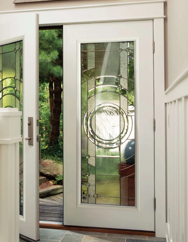 Double Entry Doors in an eggshell color with Ornate Grilles