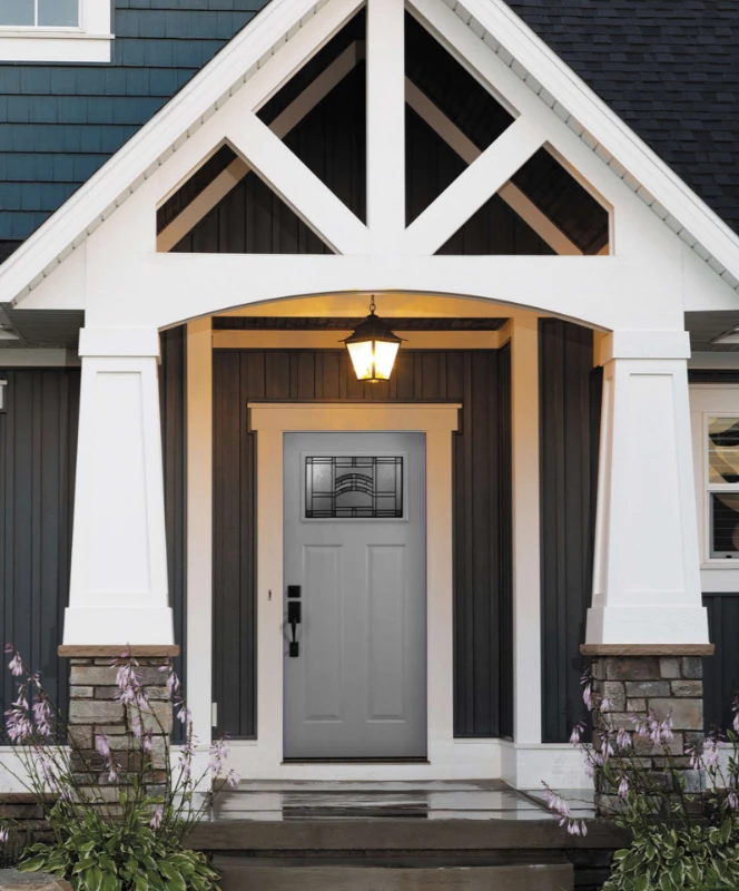 A soft pewter gray front door with a white frame