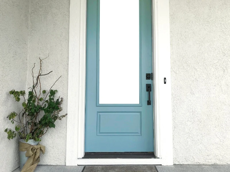 Trending Front Door Colors of 2024: A Guide to Popular Hues - Unified Home Remodeling Sky Blue Entry Door with a large glass panel in a wide white frame