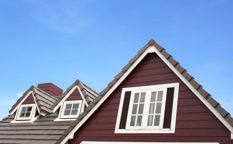 Brown tile roof in garden against blue sky. background