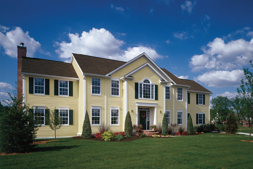 CertainTeed Siding - Unified Home Remodeling CertainTeed's MainStreet siding in yellow installed on Long Island home