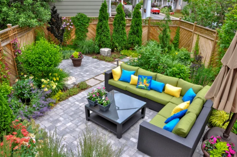 Modern backyard with a paver patio, outdoor furniture, and landscaping—shows paver patio cost and what goes into the cost of a paver patio on Long Island