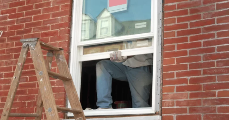 A contractor installing a double hung window from the Ideal Platinum line during a replacement project in a Long Island home. Featured as part of our Ideal Windows review, the window is designed for performance in coastal climates and older home exteriors.