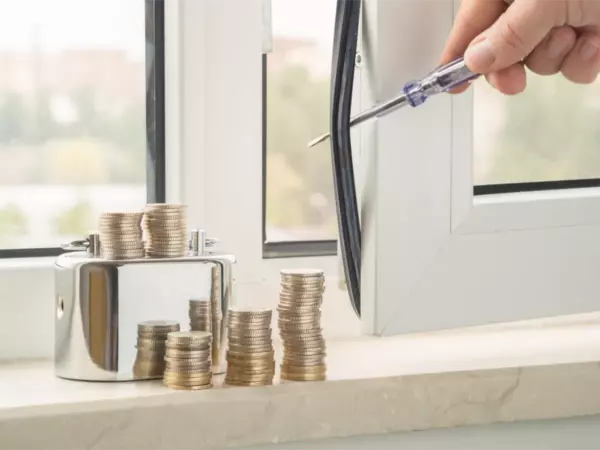 Replacement window and stacked coins representing replacement window costs for Long Island homeowners.