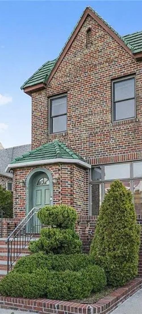 Two-story Brooklyn home with brick siding
