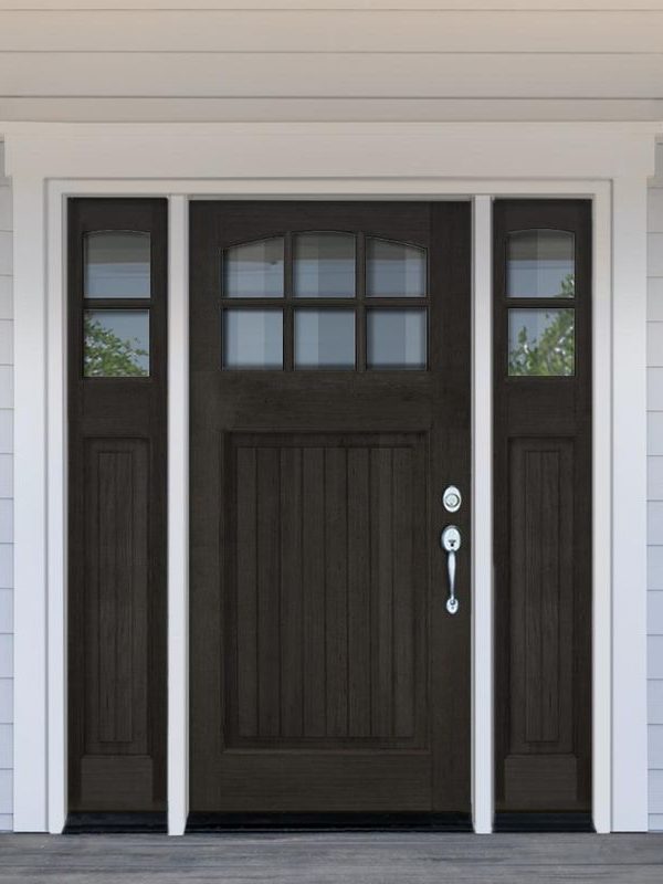 Front entry door installation in a New York home featuring a wood entry door with decorative glass panels and sidelights.