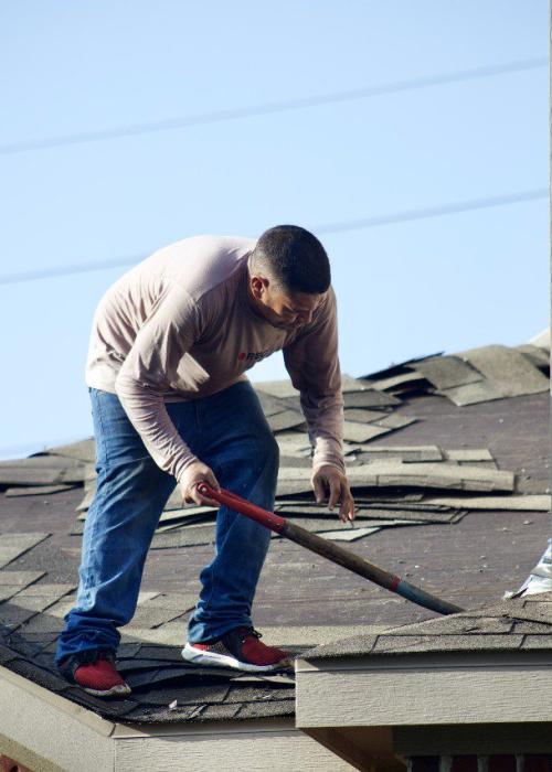 roofing crew replacing a roof